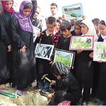 Afghan Girl Buries Toy Gun – Enough of War