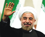(FILES) A picture taken on June 17, 2013 shows Iranian president-elect Hassan Rowhani waving as he attends a press conference in Tehran. Rowhani, the cleric and reputed moderate who is to be sworn in as Iranand#039;s president on August 3, has vowed to engage more with world powers in hopes of easing economic sanctions. AFP PHOTO/BEHROUZ MEHRI (Photo credit should read BEHROUZ MEHRI/AFP/Getty Images)