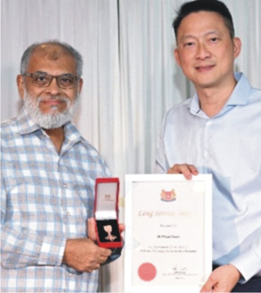 Khalid Husain Honored with  Singapore Community Long Service Award